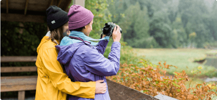 Two hikers filming in a BC Park